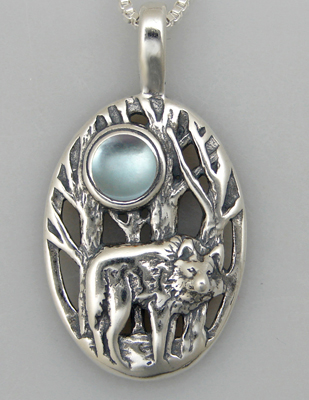 Sterling Silver Winter Wolf Pendant With Blue Topaz